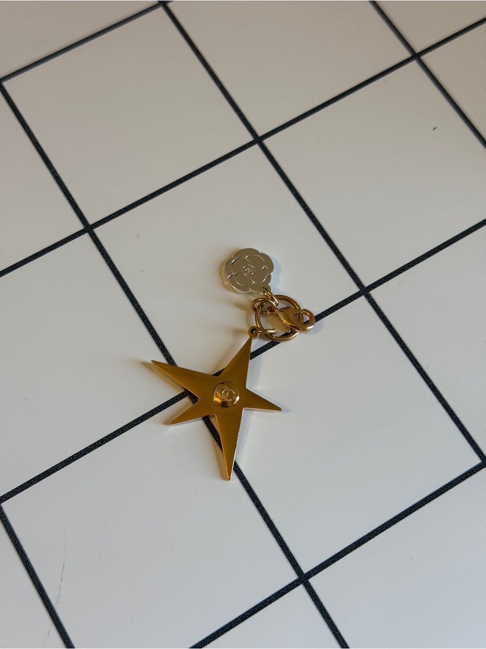 CHANEL Gold Star Charm Keychain with Camellia Tag